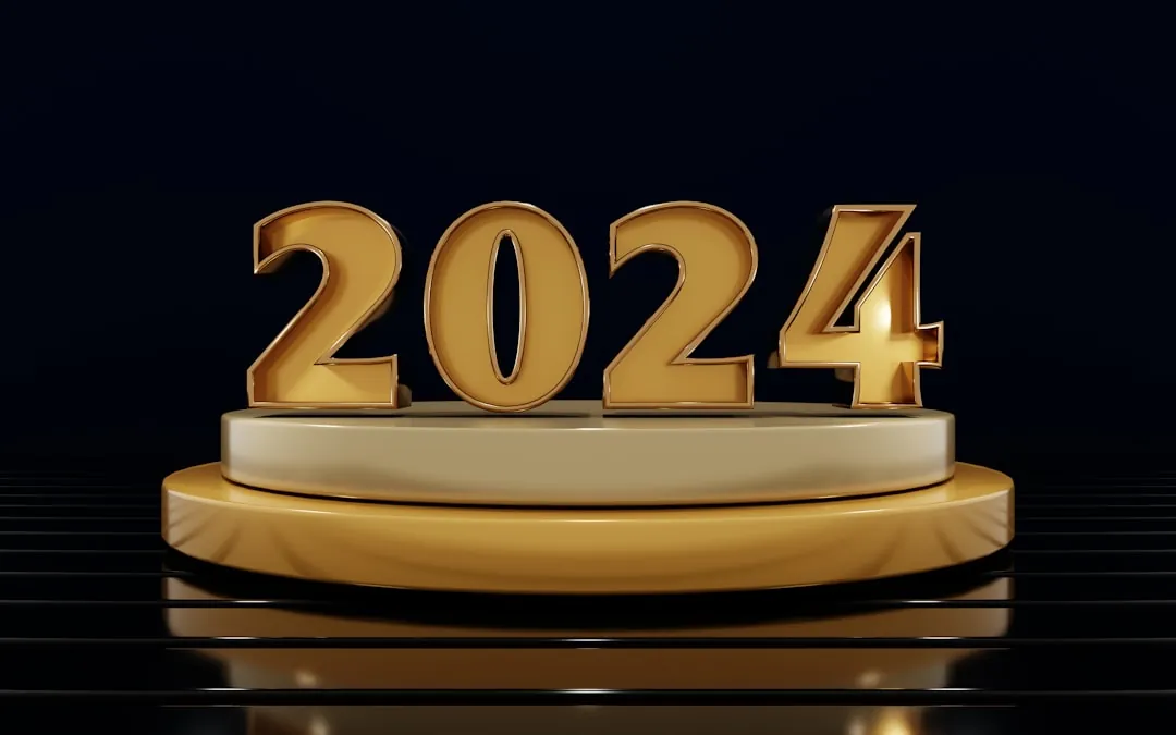 a golden sign that reads 2024 on a black background